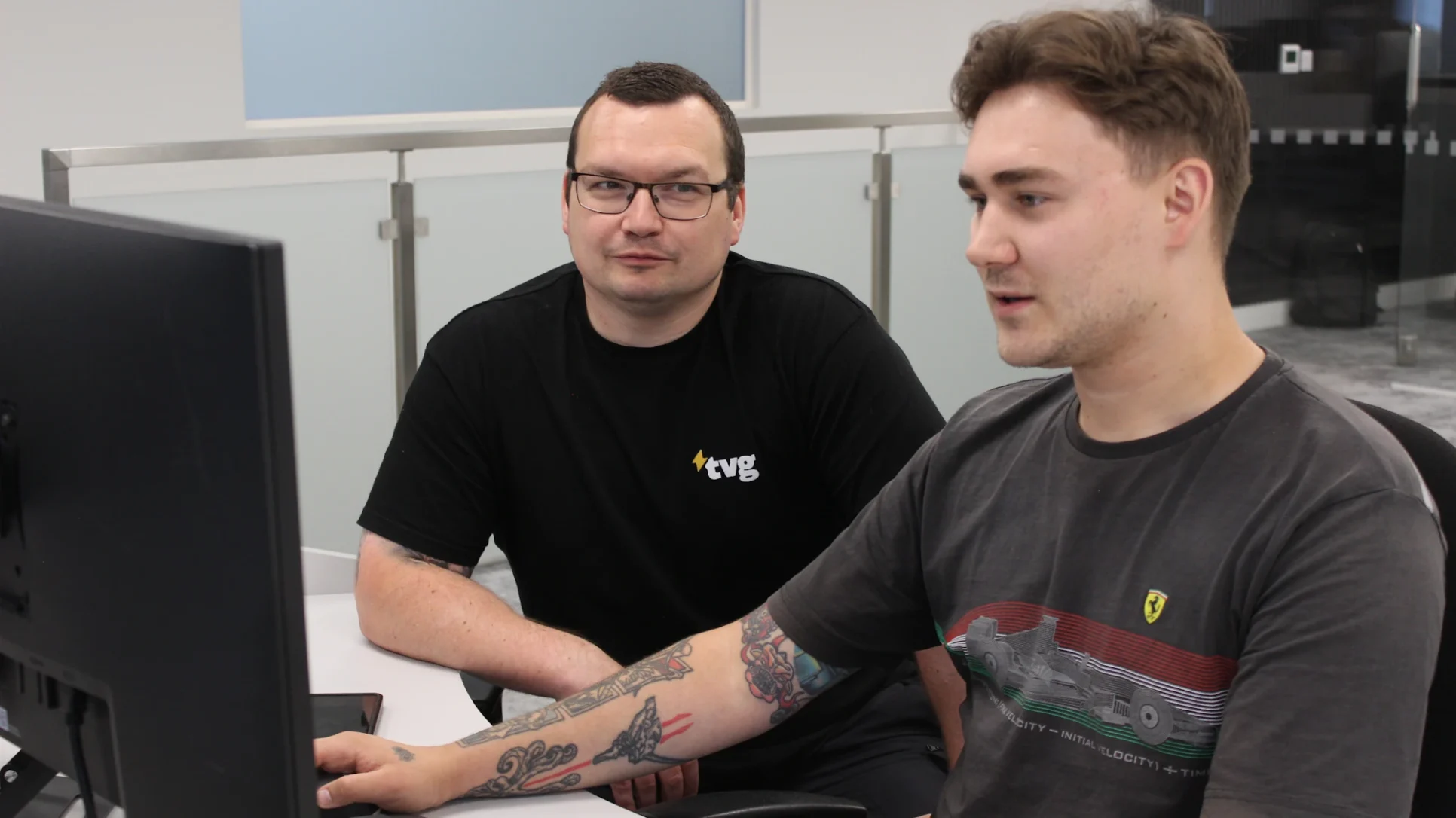Team Valley Group Matthew and Steven working together looking at a monitor.