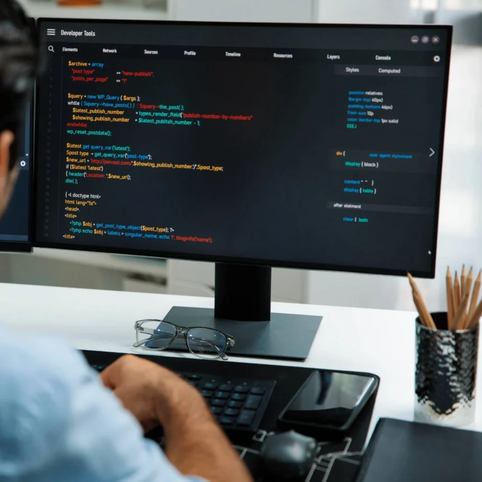 A web developer tweaking website code.