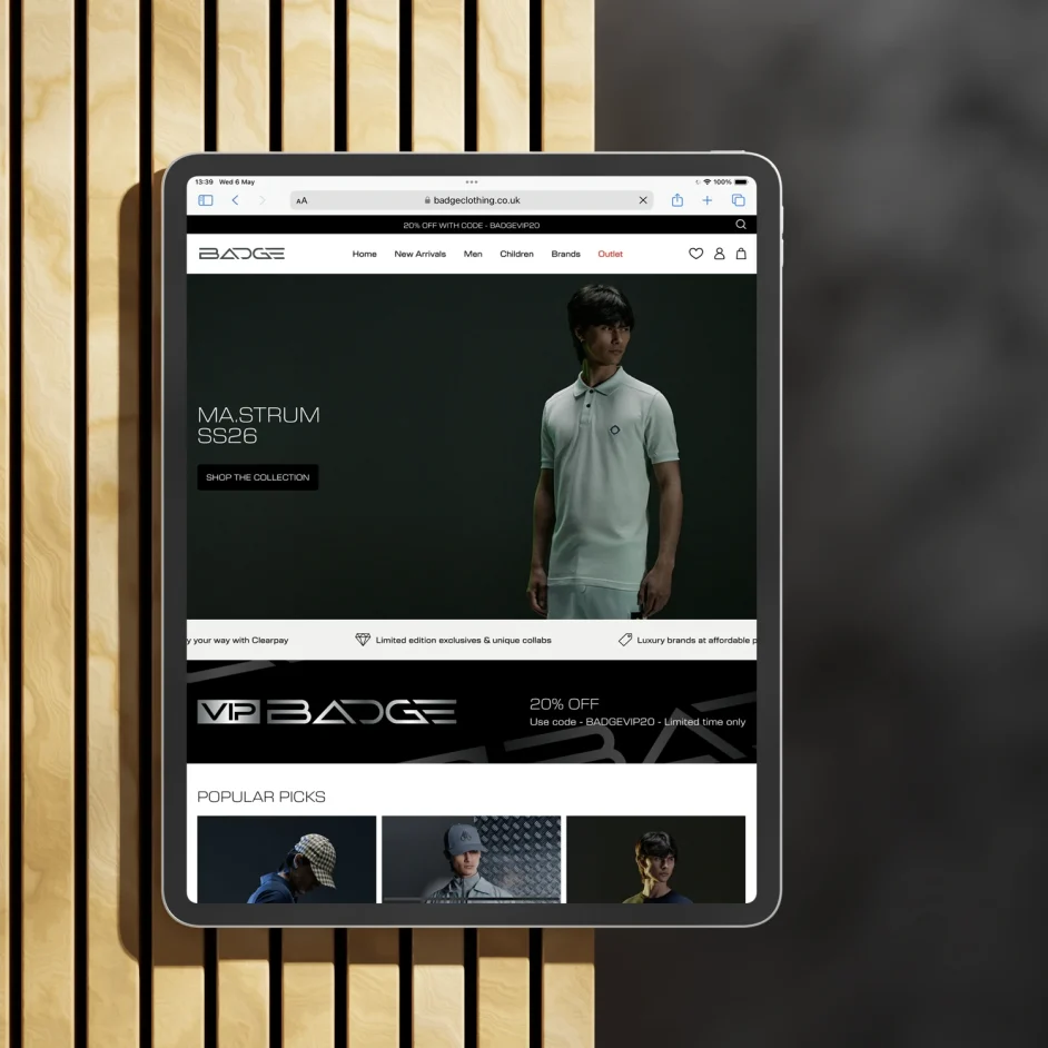 Homepage of badge website displayed on an iPad screen.